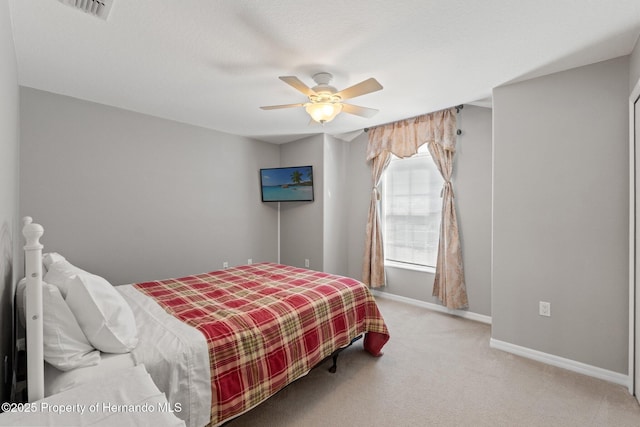 carpeted bedroom featuring ceiling fan