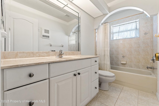 full bathroom with toilet, vanity, tile patterned floors, and shower / bath combo with shower curtain