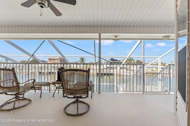 sunroom with a healthy amount of sunlight and a water view