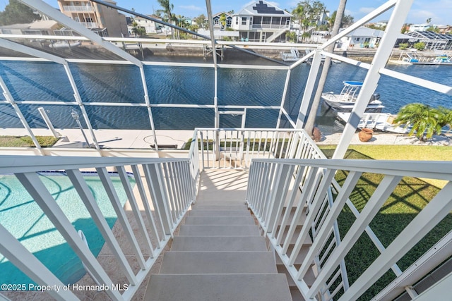 view of pool featuring a water view