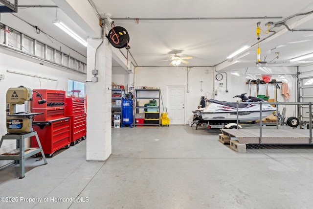 garage with a garage door opener and a workshop area