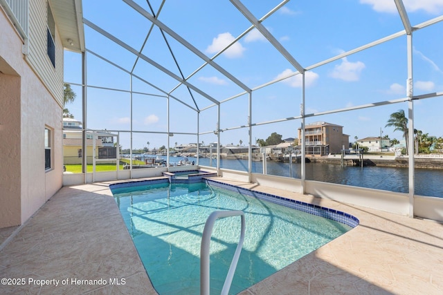 view of swimming pool featuring an in ground hot tub, a water view, a lanai, and a patio area