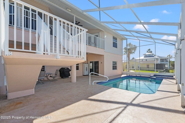 view of pool featuring a lanai and a patio