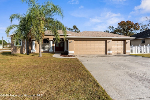 ranch-style home with a garage and a front lawn