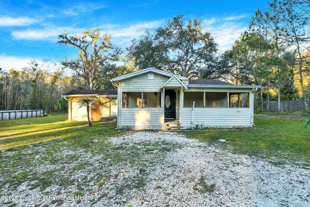 ranch-style home with a front yard