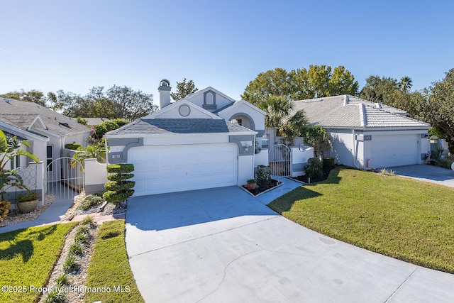 ranch-style home with a front yard and a garage