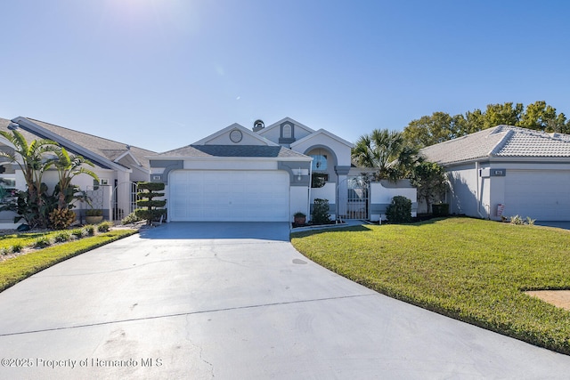 single story home with a front yard and a garage