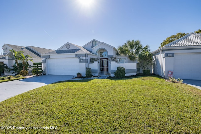 single story home featuring a front yard and a garage