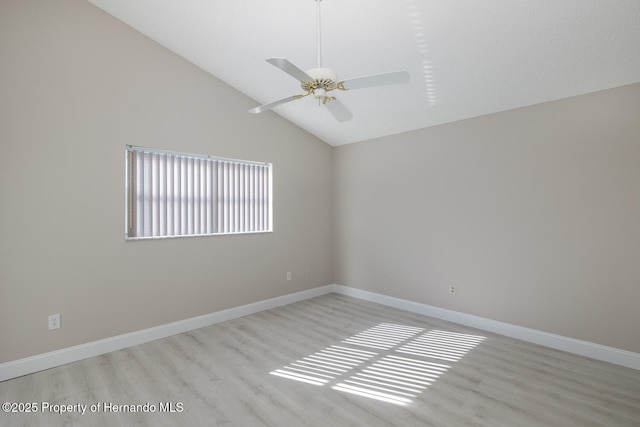 empty room featuring ceiling fan, high vaulted ceiling, and light hardwood / wood-style floors