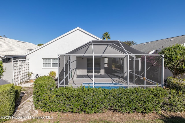 rear view of house with a lanai