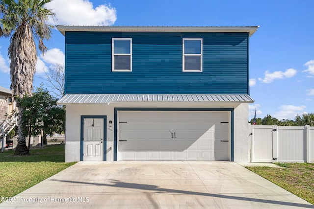 3276 Sea Grape Dr, Hernando Beach, FL 34607 - view of front facade with driveway, a gate, an attached garage, a front yard, and stucco siding