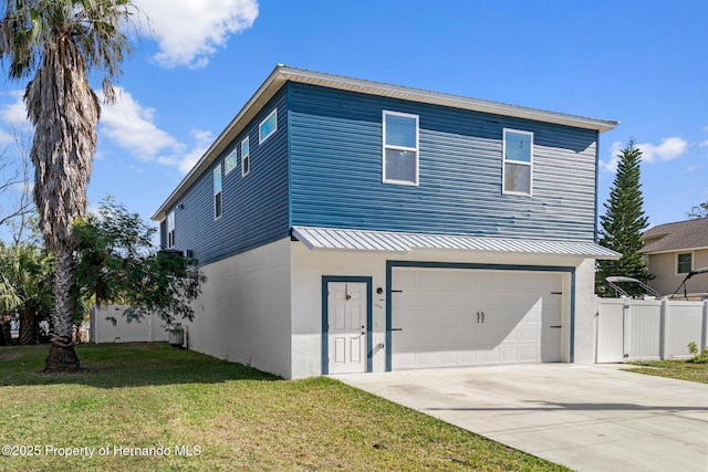 view of front of property featuring a garage and a front yard