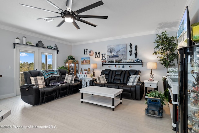 living room featuring ceiling fan and ornamental molding