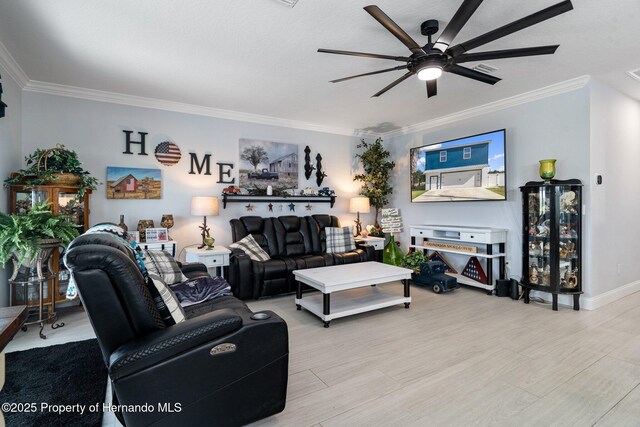 living room featuring ceiling fan and crown molding