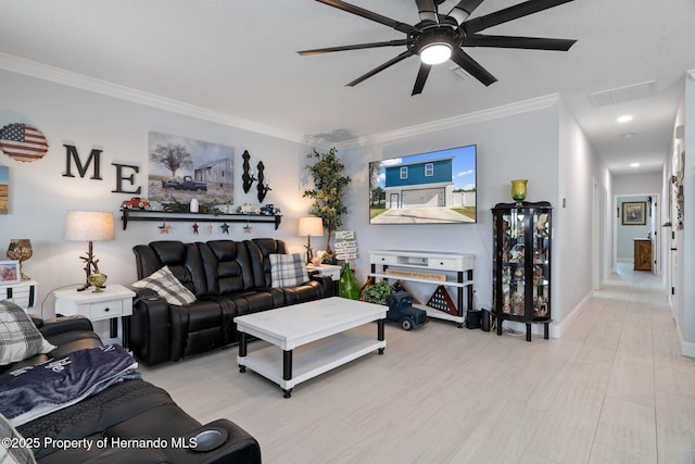 living room with ceiling fan and crown molding