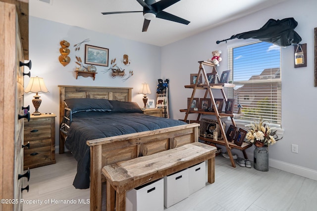 bedroom featuring ceiling fan and light hardwood / wood-style flooring