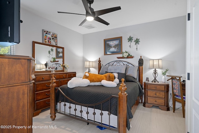 bedroom with ceiling fan and light hardwood / wood-style floors