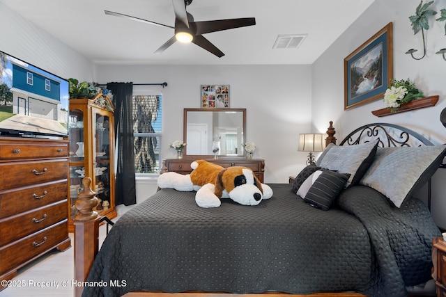 bedroom featuring light hardwood / wood-style flooring and ceiling fan