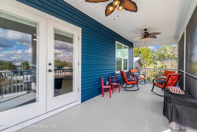 view of patio featuring french doors and ceiling fan