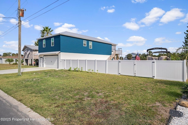 view of home's exterior featuring a yard and a garage