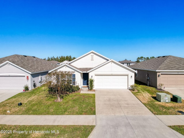 ranch-style home with a front yard and a garage