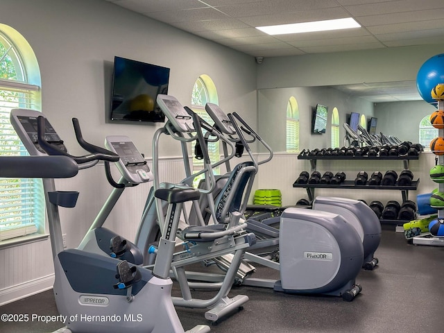 workout area featuring a paneled ceiling