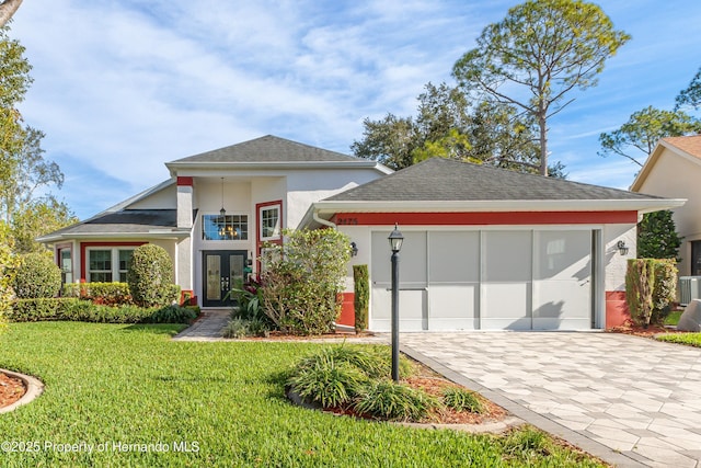 view of front of home featuring french doors and a front lawn