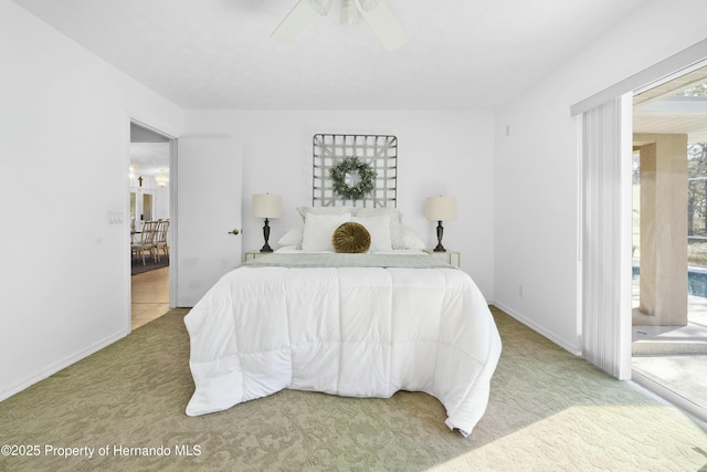 carpeted bedroom featuring multiple windows and ceiling fan