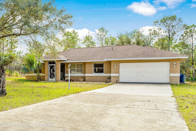 single story home with a front yard and a garage