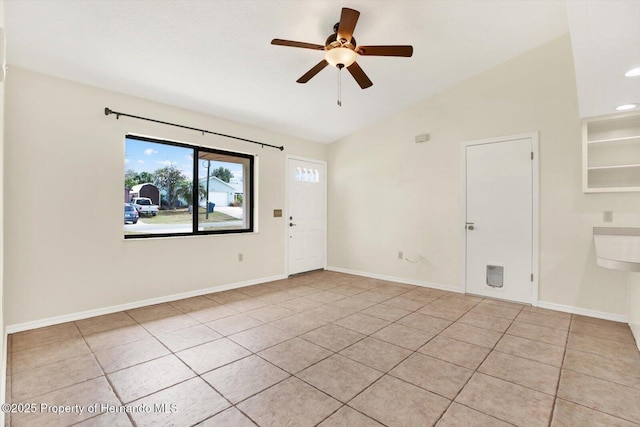 tiled spare room with ceiling fan and lofted ceiling