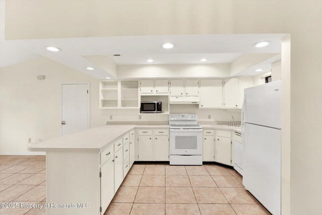 kitchen with white cabinetry, white appliances, and light tile patterned floors