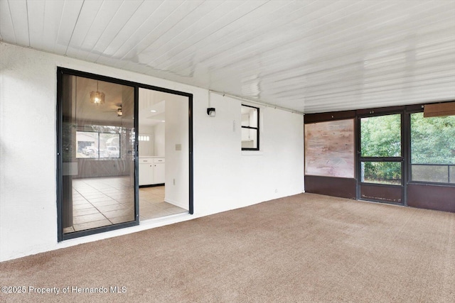 unfurnished sunroom featuring a wealth of natural light