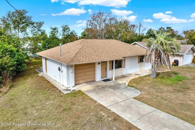 single story home featuring a garage and a front yard