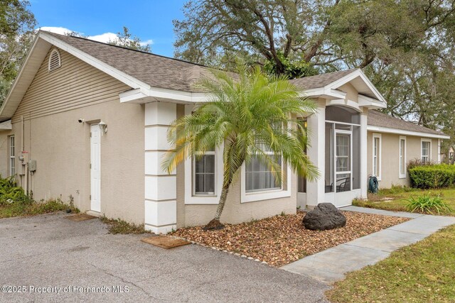 37351 Neighbors Path, Zephyrhills, FL 33542 - view of property exterior featuring a sunroom