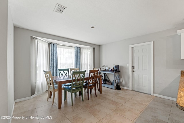 37351 Neighbors Path, Zephyrhills, FL 33542 - dining space featuring light tile patterned floors