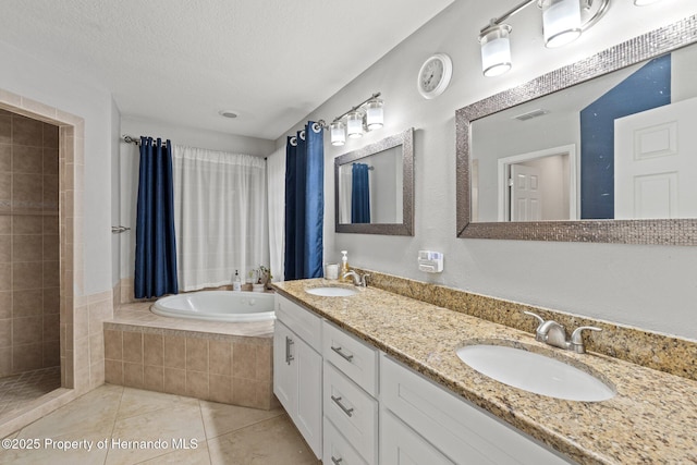 37351 Neighbors Path, Zephyrhills, FL 33542 - bathroom featuring vanity, shower with separate bathtub, tile patterned flooring, and a textured ceiling