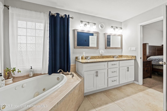 37351 Neighbors Path, Zephyrhills, FL 33542 - bathroom with tile patterned flooring, tiled tub, and vanity