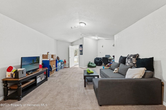 37351 Neighbors Path, Zephyrhills, FL 33542 - living room featuring a textured ceiling, vaulted ceiling, and light carpet