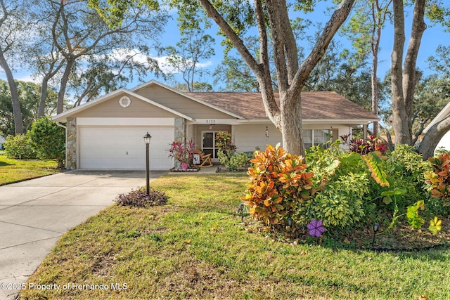 ranch-style house with a front yard and a garage