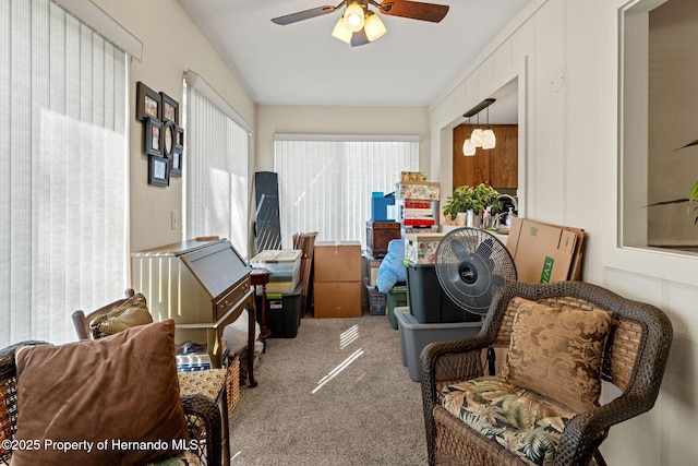 sitting room with carpet floors and ceiling fan