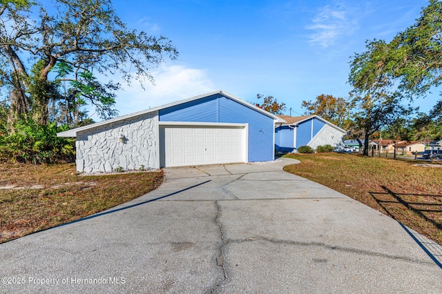 view of front of house with a garage and a front yard