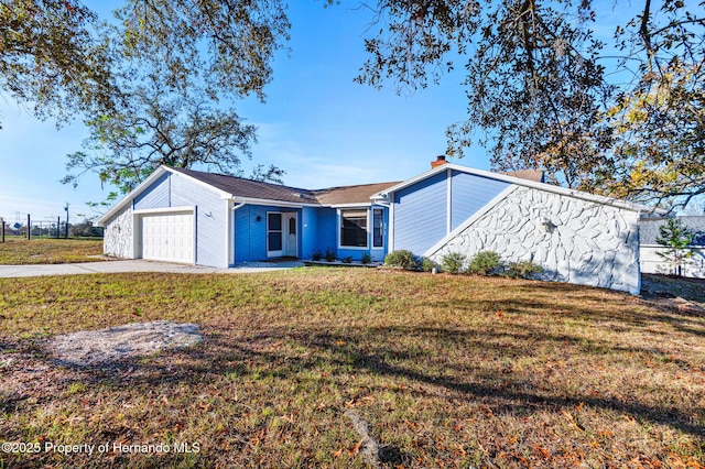 ranch-style house with a front lawn and a garage