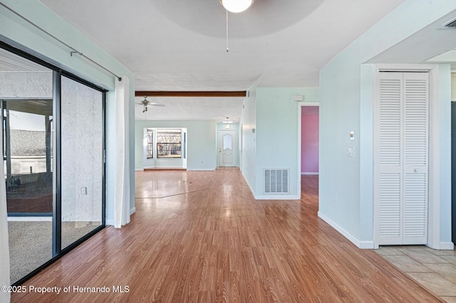 unfurnished room with ceiling fan and light hardwood / wood-style floors