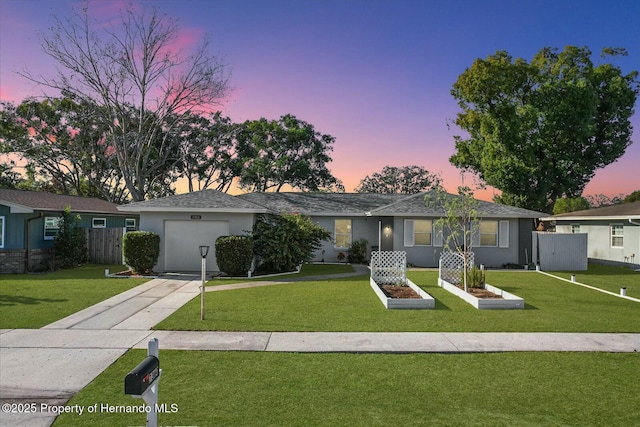 ranch-style home featuring a yard