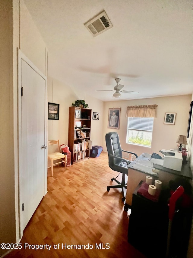 office featuring wood-type flooring and ceiling fan