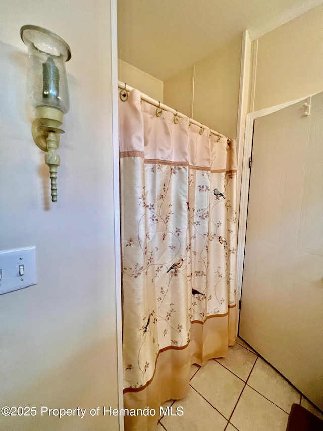 bathroom with tile patterned floors