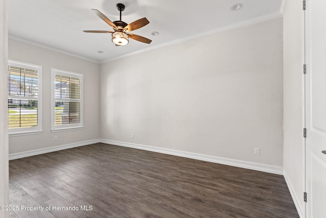 empty room with crown molding, dark hardwood / wood-style flooring, and ceiling fan