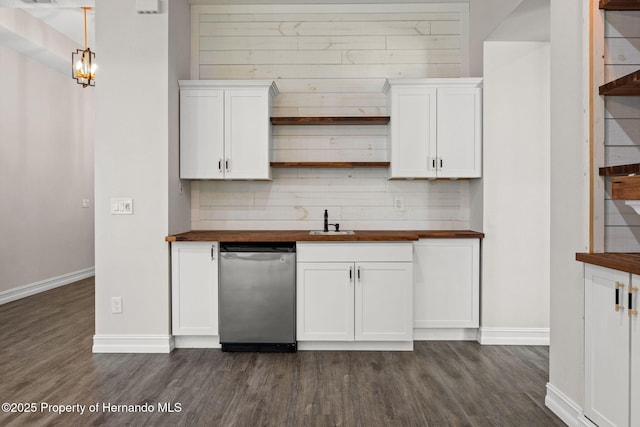 kitchen featuring wooden counters, decorative backsplash, dark hardwood / wood-style flooring, pendant lighting, and white cabinets