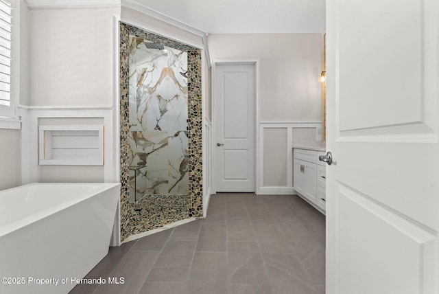 bathroom featuring tile patterned flooring, vanity, and shower with separate bathtub