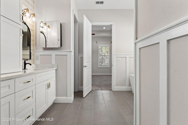 bathroom with tile patterned flooring and vanity